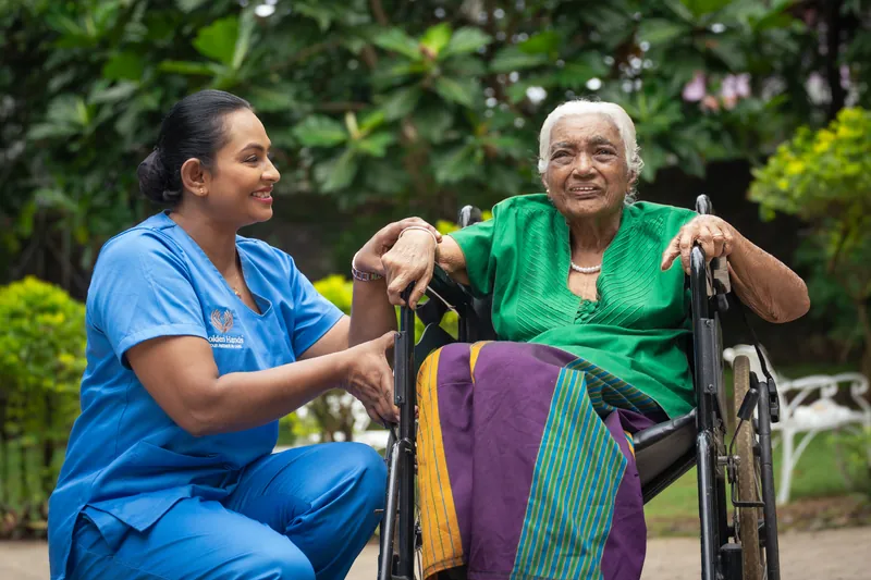 A Golden Hands caregiver sharing a moment with a resident