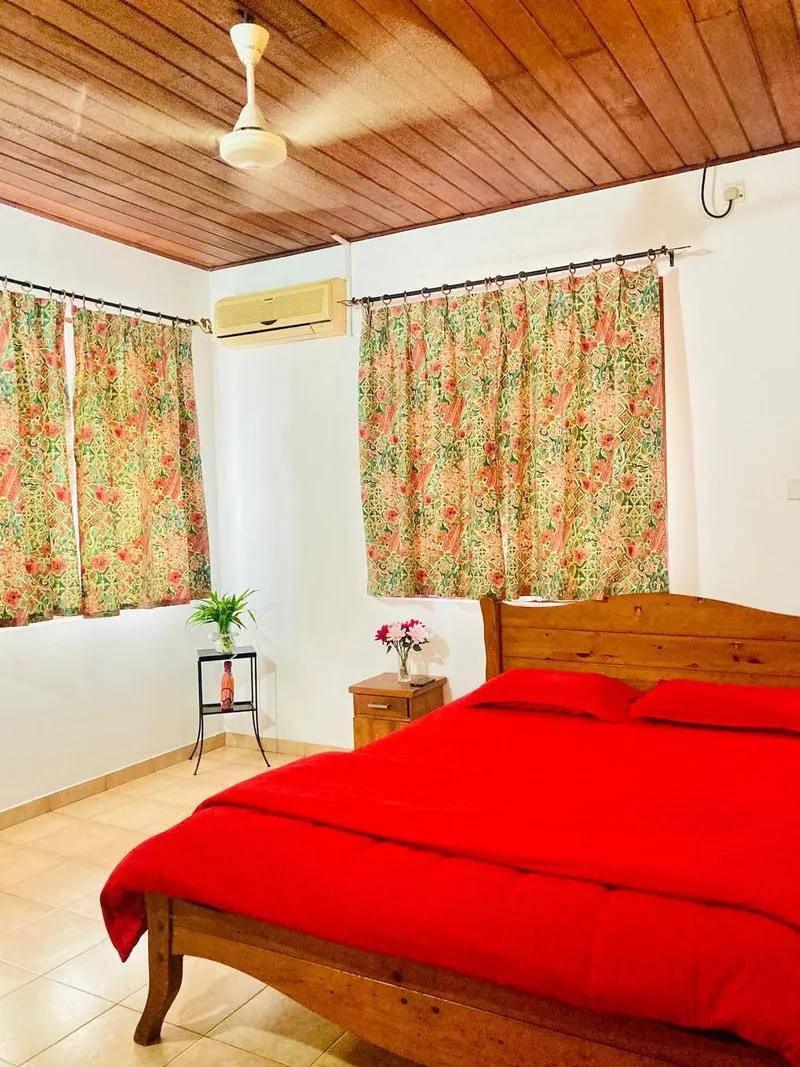 A Single Standard AC room at Golden Hands — made bed, air-conditioning, private storage